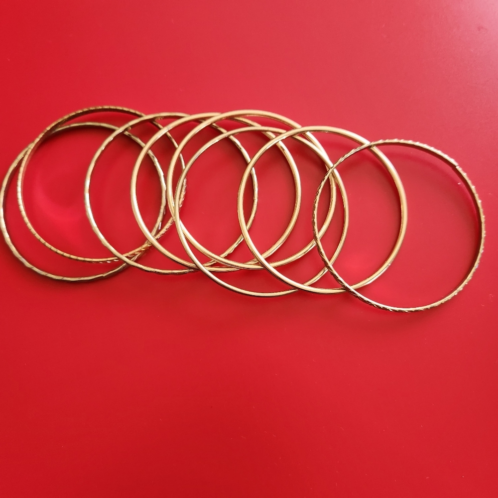 Designer Set of 9 Goldtone Bangle Bracelets